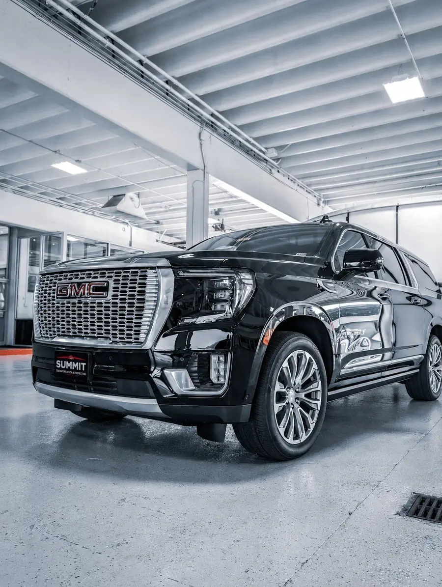 Black GMC Yukon luxury SUV from the Summit fleet